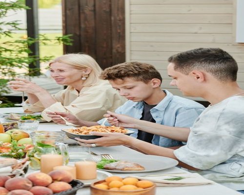 Family eating together calmly without phones or distractions
